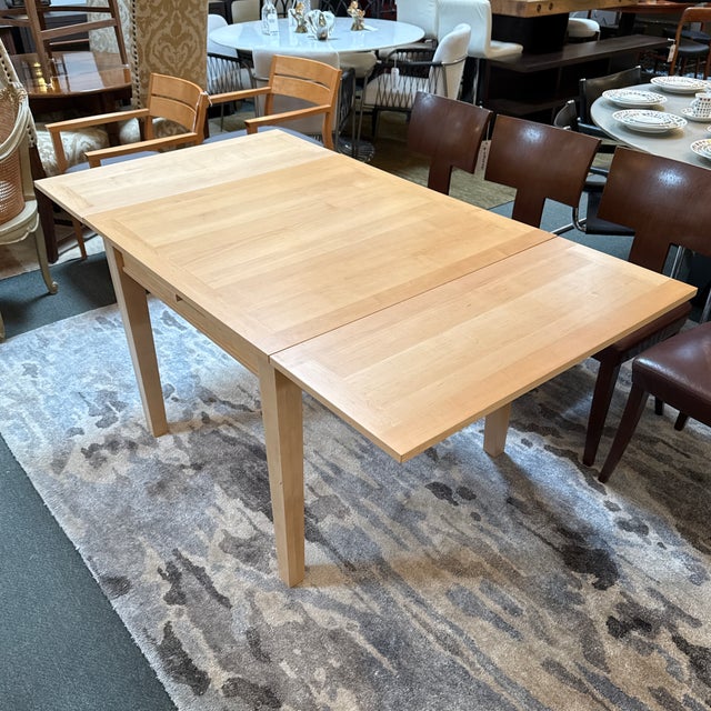 Design Plus Gallery presents an Extending Dining Room Table from Crate & Barrel. The table is crafted form solid wood with...