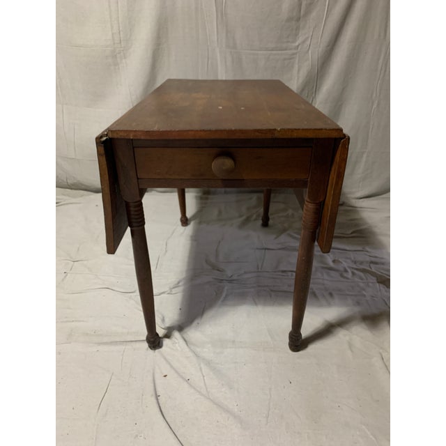 Antique drop leaf table with drawer. Very nice as a rustic primitive kitchen or breakfast table. With leaves up, total...
