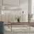 Four textured cast-glass tiles form a simple grid, their thicker, irregular edges appearing darker than the ice-like...