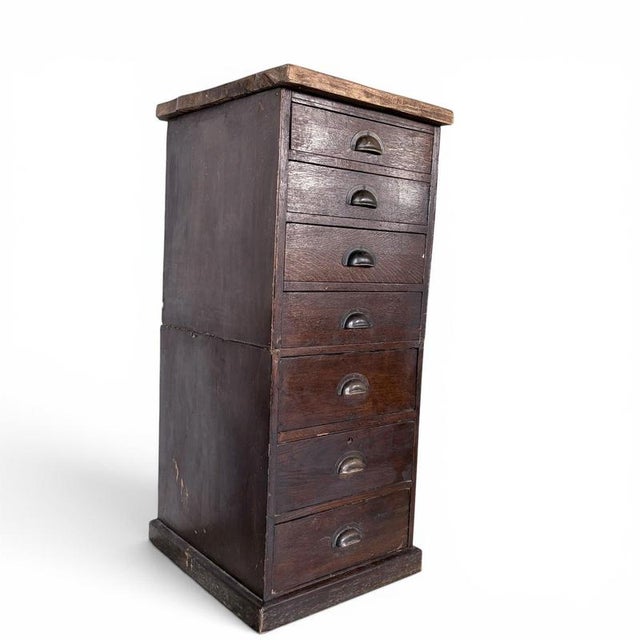 Details * Early 20th century banker’s chest * Tiger oak drawer fronts * Seven drawers * Original metal cup pull handles *...