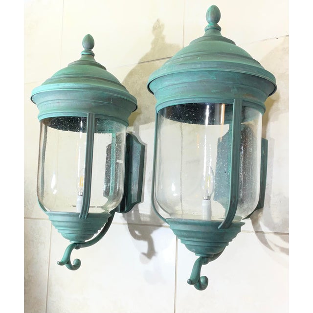 Elevate your home’s exterior or entryway with this spectacular, matching pair of heavy, solid brass wall-mounted lanterns....