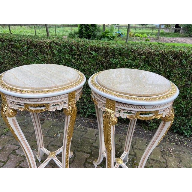 Elevate your interior with this elegant pair of French Louis XVI-style side tables, dating from the 1970s. Beautifully...