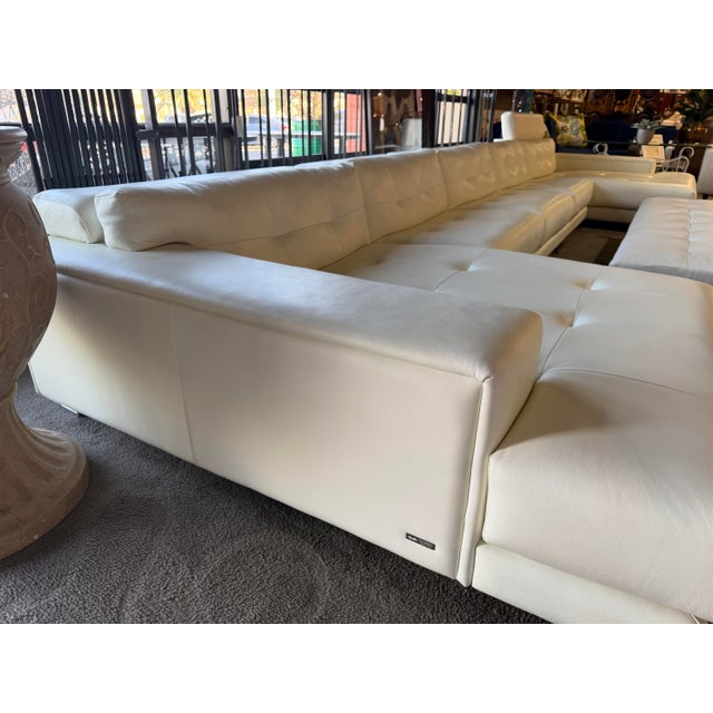 Elevate your living space with the refined Italian craftsmanship of this Gamma five-piece sectional, a statement piece...