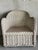 Vintage rattan barrel back chair frame featuring large scale braid detail and a sculptural wraparound form. Off-white...