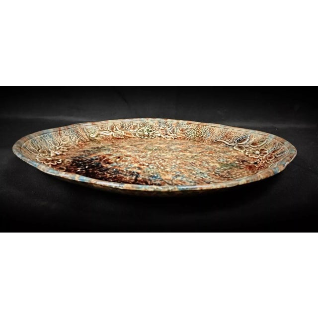 This charming vintage 20th-century serving platter features a beautiful floral design, making it an elegant addition to...
