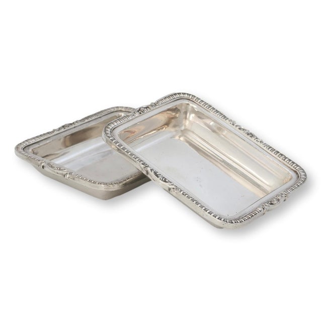 Pair of miniature silverplate covered tureens by Reed & Barton, dating to the mid 20th century. These charming lidded...