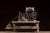 Compact, bench-mounted salesman's model demonstrating a mechanical tube flaring process, likely used in the presentation...