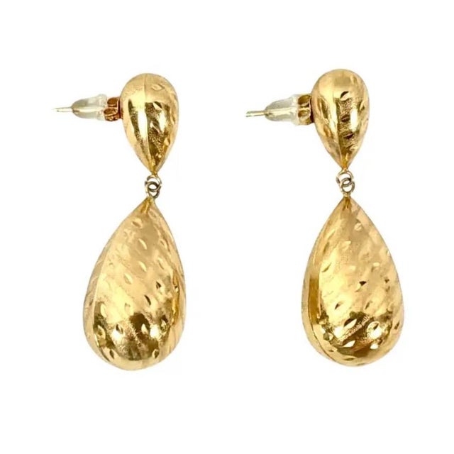 Vintage Pair of 14K Gold Textured Drop Earrings. Earrings are in a beautiful sculptural teardrop silhouette with a finely...