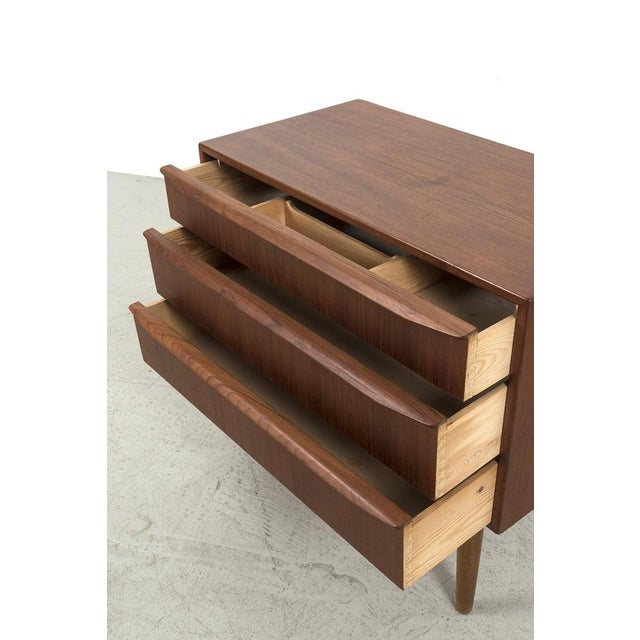 Danish cabinet with 3 drawers and beautifully shaped handles. In good vintage condition. Measurements H. 71 cm; W. 78,5...