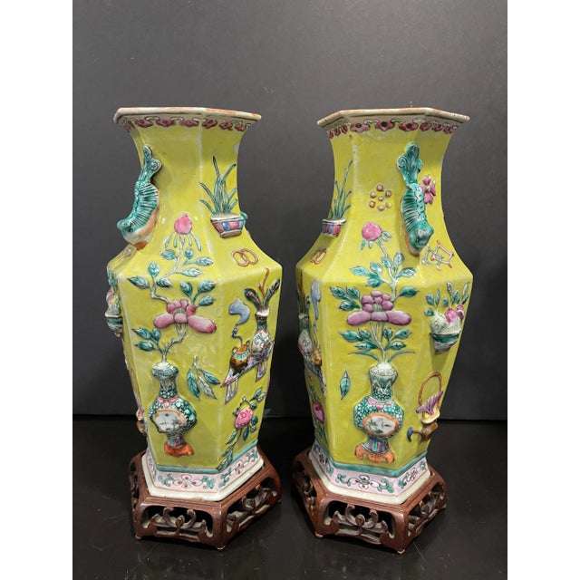A Pair of Chinese 19th Century Famille Rose High Relief Yellow Ground Porcelain Vases, 6 lobed shaped vase With hand...