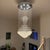 This stunning modern crystal raindrop chandelier features cascading crystal strands that form a dramatic, sculptural focal...