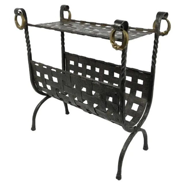 A unique, black iron drink table and magazine holder. Handcrafted with exceptional attention to detail, this unique piece...