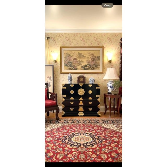 A striking mid-century Japanese Isho-Tansu (衣装箪笥) chest, masterfully crafted from solid Kiri (Paulownia) wood and finished...