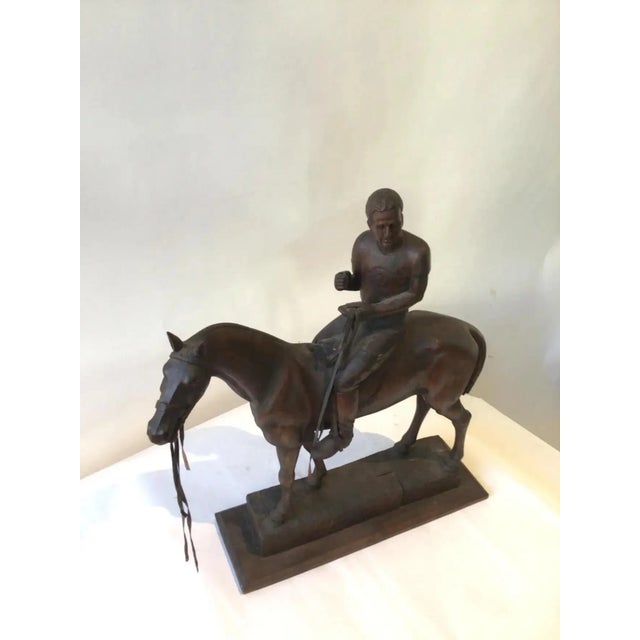 Carved wood sculpture of Juan Carlos Harriott on a polo pony by E. Dombrowe.