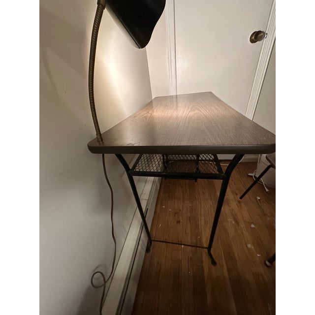 Wrought iron black shelves (4); built-in black metal lamp; matching chair total = 2 pieces