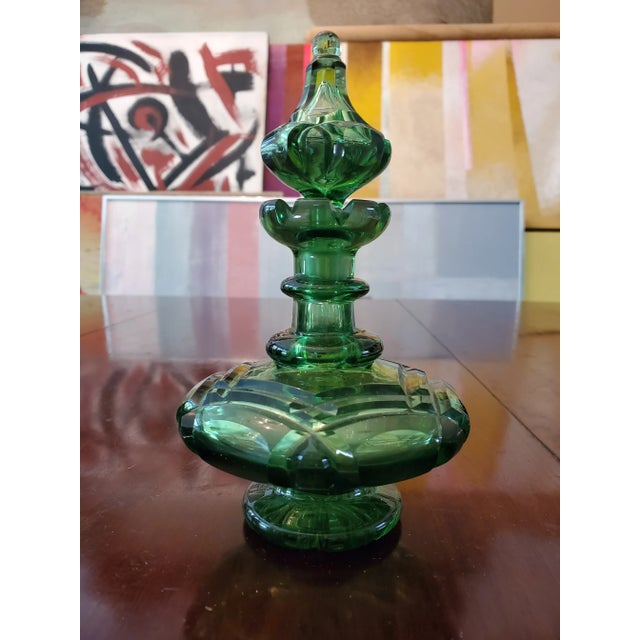 A very fine mid century modern emerald color crystal perfume bottle. Absolutely brilliant in every way with masterfully...