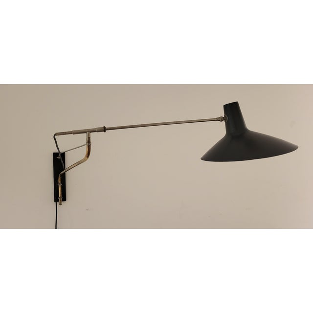 Artimeta wall lamp with fully adjustable swivel arm, 1960s. This rare wall lamp is very functional due to the swivel arm...