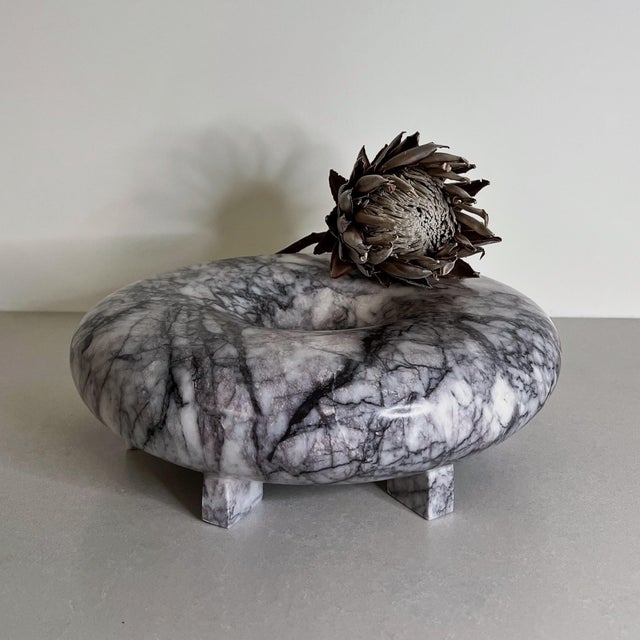 Handcrafted from richly veined white marble, the Elevated Bowl is defined by its low, rounded silhouette and subtle raised...