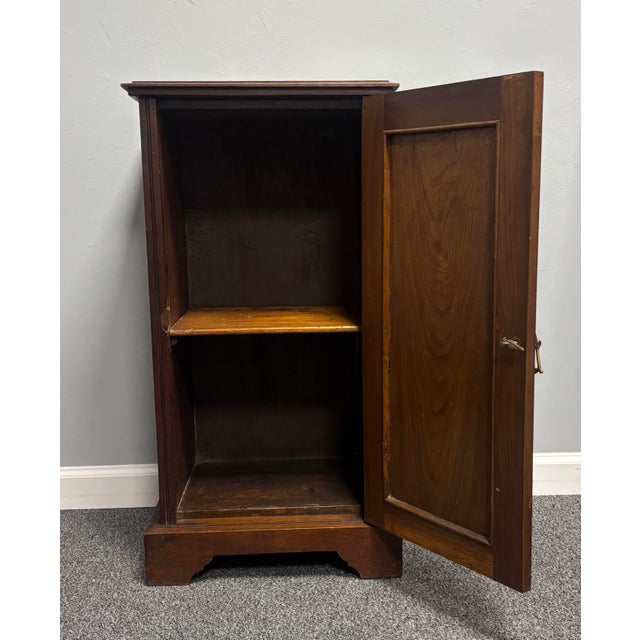 An early 20th century English mahogany pot cupboard nightstand of most pleasing form and character. The richly toned...
