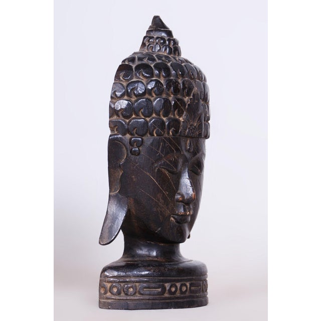 This impressive sculpture of Buddha's head dates back to the beginning of the 20th century and is an example of...