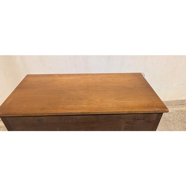 This vintage Henredon tall chest embodies the architectural grace of French Neoclassical Louis XVI style, offering a...