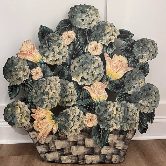 This exquisite hand-painted and signed toleware fireplace screen showcases a charming woven wicker basket brimming with...