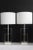 A beautiful Pair of geometric Lucite table lamps.The shaping of the Lucite give these lamps an unusual look. Mounted on...