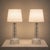 Elegant pair of mid-century modern crystal table lamps designed by Carl Fagerlund for Orrefors, Sweden, circa 1960s. These...