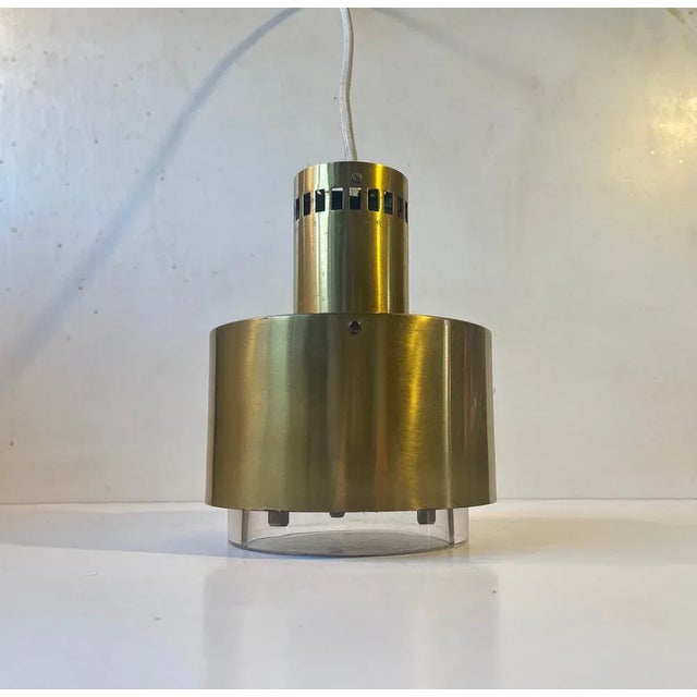 A very rare solid brass and crystal pendant light designed by the danish architect kay kørbing in 1967 for the two danish...