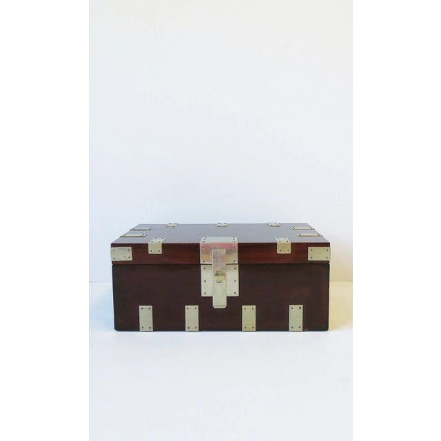 A relatively large rich dark red burgundy lacquer storage box chest with metal detail by designer Rae Kasian, in the...