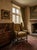 Queen Anne Early 20th Century Wingback Armchair Featuring a Floral Tapestry Fabric and Turned-Spindle Wooden Legs For Sale - Image 3 of 3