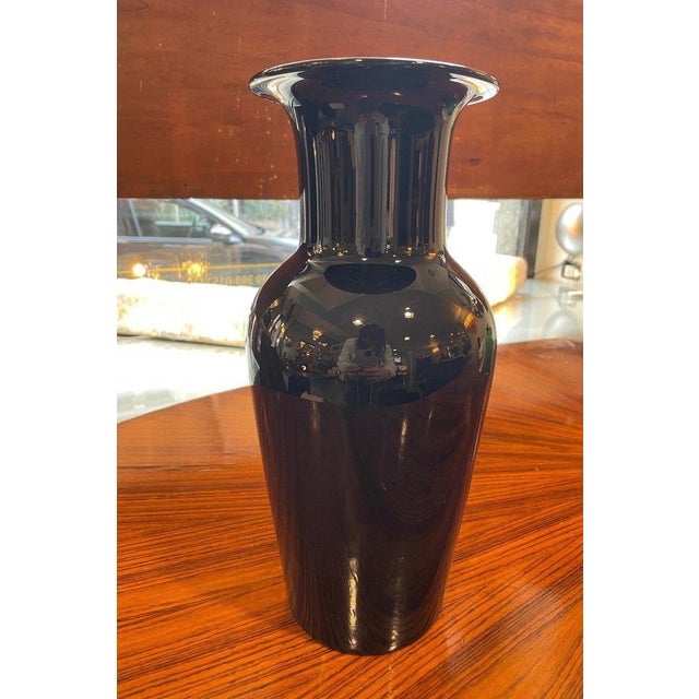 Murano black glass vase, 1960 signed Barovier on the base. The vase features an elegant conical shape with a long neck and...