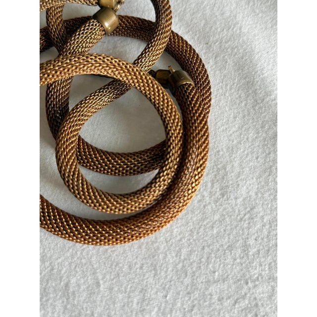 Vintage 1980s statement collar necklace featuring a thick, flexible tubular construction formed from finely woven metal...