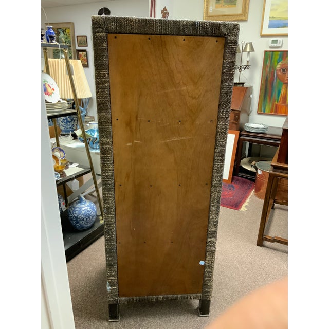 20th century tall rope chest with seven drawers. Wood and veneer drawers. Two-tone rope design detail. Wood handle and...