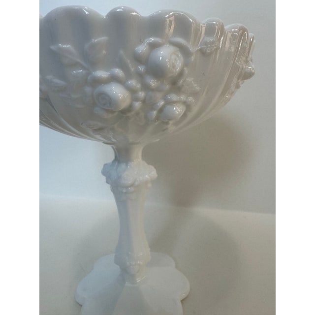 Elevate your tabletop or vanity with this exquisite mid-century milk glass pedestal compote. Featuring a lush, deeply...