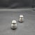 This marvelous pair of individual bulbous shaped salt and pepper shakers are created in gorgeous 900 coin silver by the...