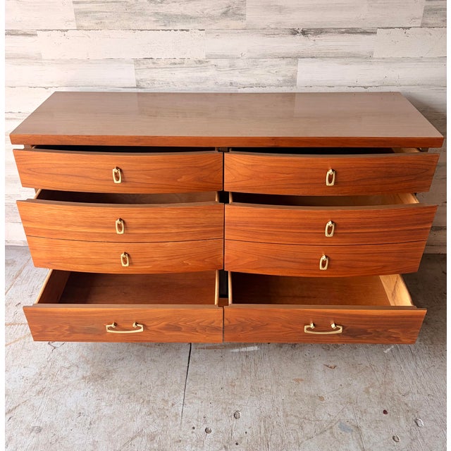Vintage Mid Century Modern dresser. Bassett Furniture Industries Inc. Walnut wood with original brass handles. Six drawers...