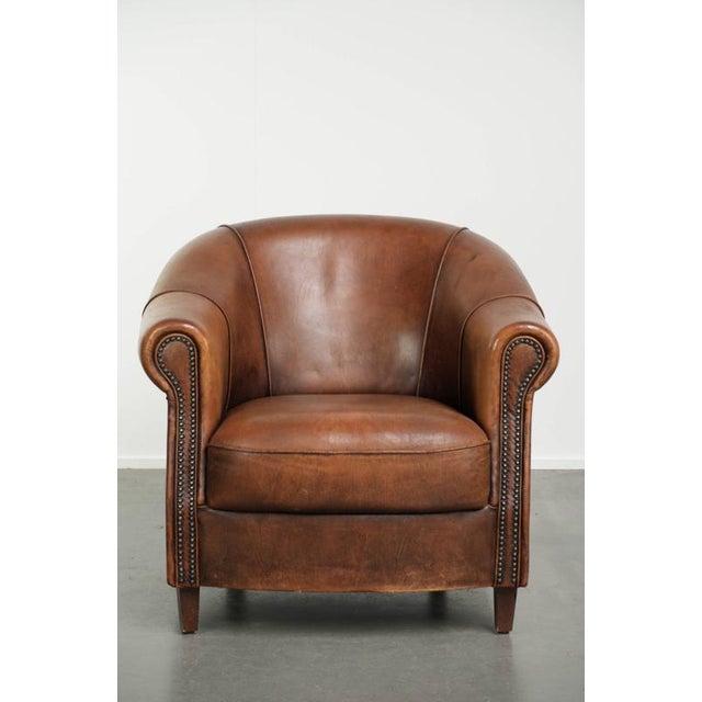 This beautiful cognac-colored sheepskin club chair is crafted in a gorgeous cognac shade and finished with decorative...