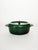 Vintage green enameled cast iron casserole dish, typical of the robust and durable cookware of the 1970s. Featuring a...
