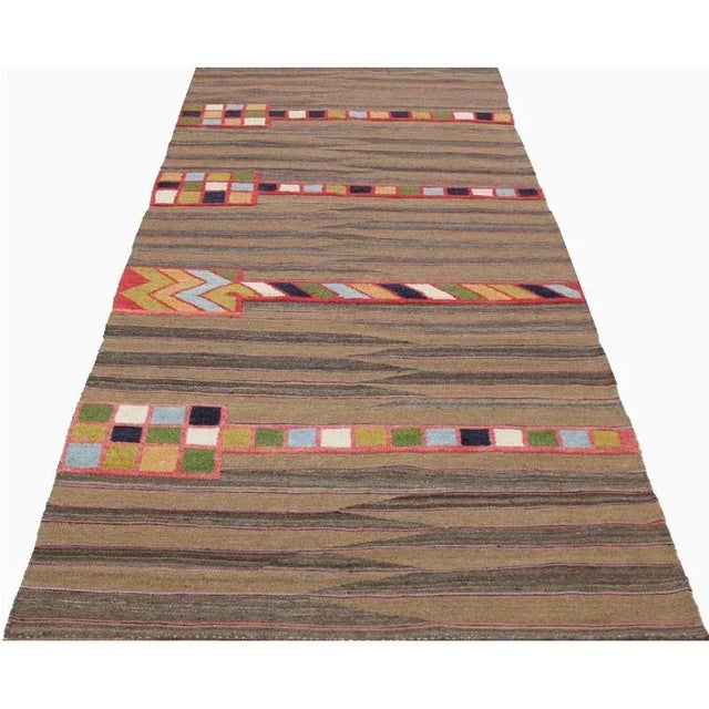 This bewitchingly beautiful example of a tribal Kilim area rug features a contemporary pop of electrifying bright colors...
