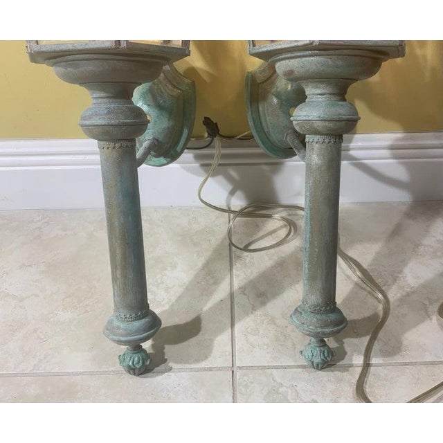 Elevate your architectural interior or exterior space with this exceptional matching pair of vintage solid brass wall...