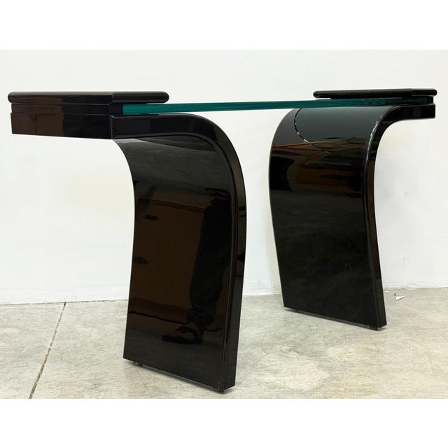 1980s Italian Postmodern Lacquered Wood and Glass Console Offered for sale is a 1980s Italian black lacquered wood console...