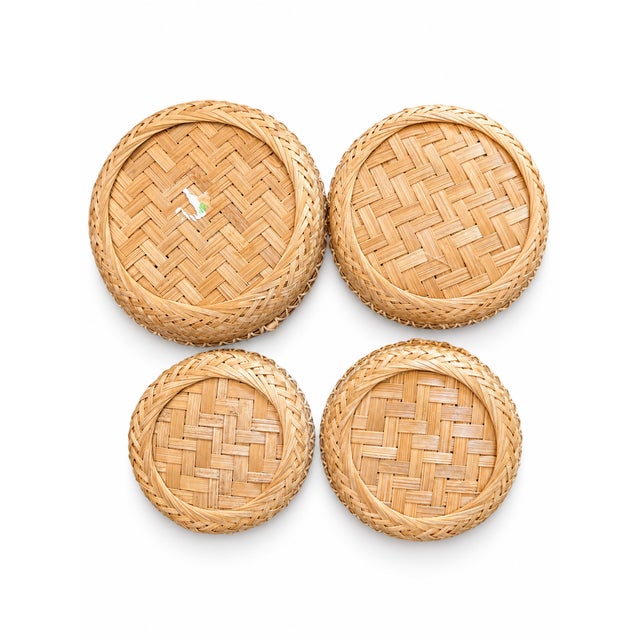 A lovely set of four petite handwoven bamboo baskets in graduated sizes. Each shallow basket features an intricate open...