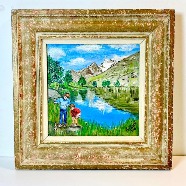 What a charming oil painting of two young boys out by a lake on a day of fishing. It’s beautifully executed by the artist...