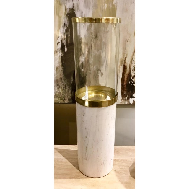 Modern contemporary Arteriors Lucy Large Marble Hurricane, white marble base with gold bantered glass top, showroom floor...