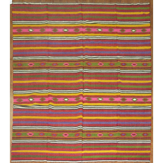 Colorful mid-20th century Turkish flat-weave Kilim. Measures: 6'9'' x 9'6''.