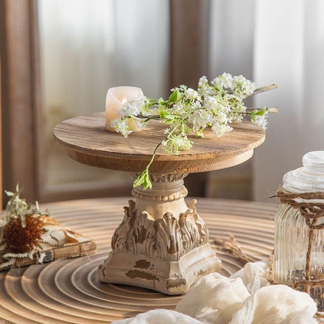 Made of solid wood with an aged finish, these pieces exhibit a worn and mottled vintage texture. The base features...