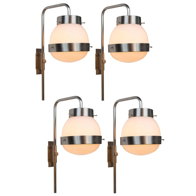 1960s Sergio Mazza 'Delta' wall lights for Artemide. Executed in brushed nickelled brass, pressed and glossy opaline...