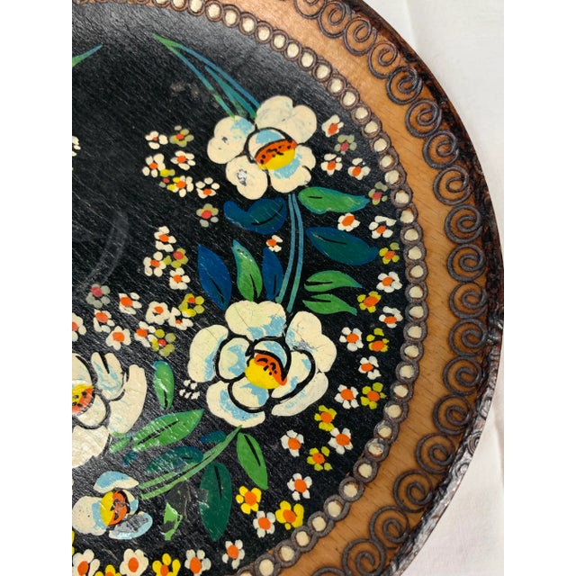 Beautiful vintage wooden plate. Hand painted floral design. Perfect for display on a stand or wall. This is a pre-owned...