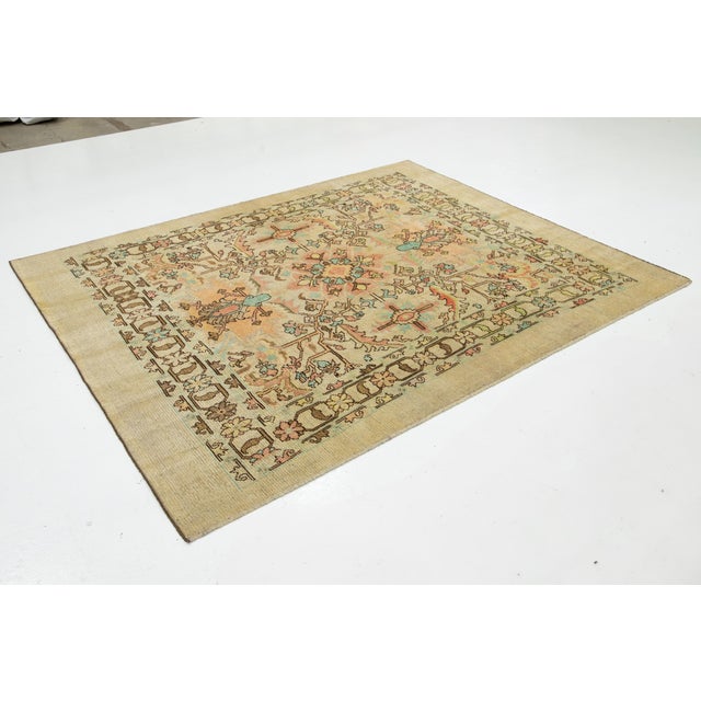 Gorgeous modern hand-knotted wool rug featuring a tan field. This Apadana Revival Collection rug showcases a stunning...